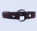 A brown leather collar with a metal ring and floral designs.