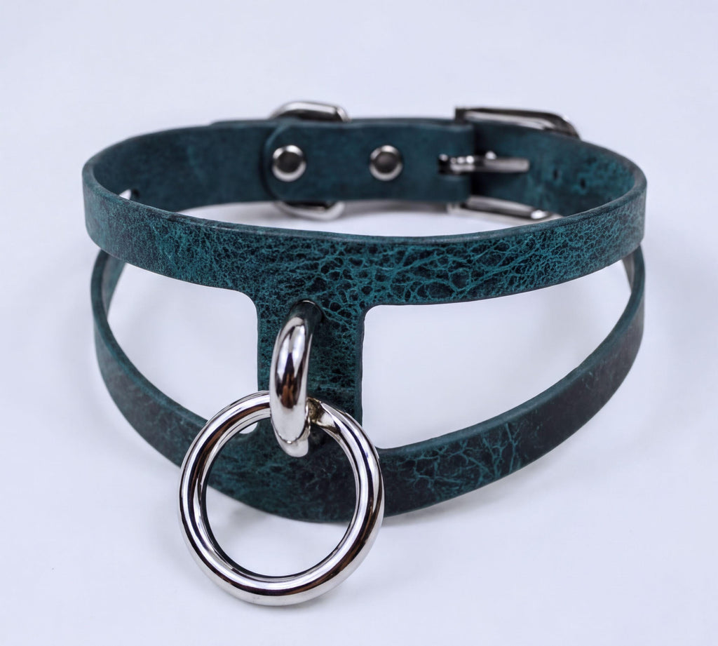 A dark green choker necklace with a silver ring and buckle.