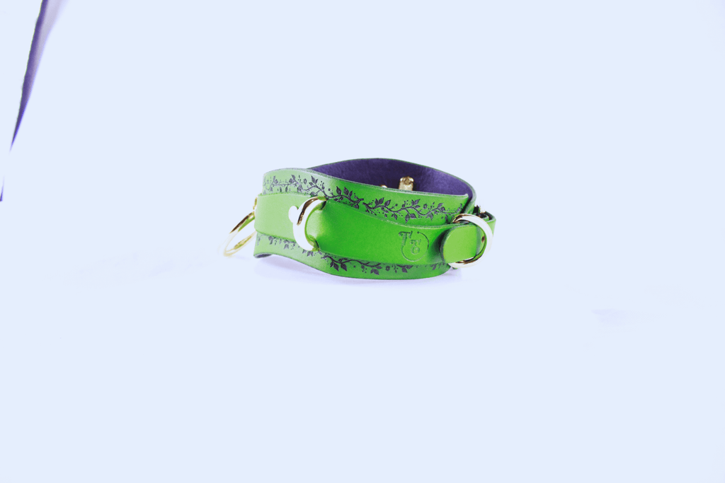 Green Vine Leather Submissive Collar featuring a delicate vine pattern and polished rings, perfect for elegant style.