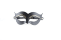A black leather mask with decorative eye embellishments.