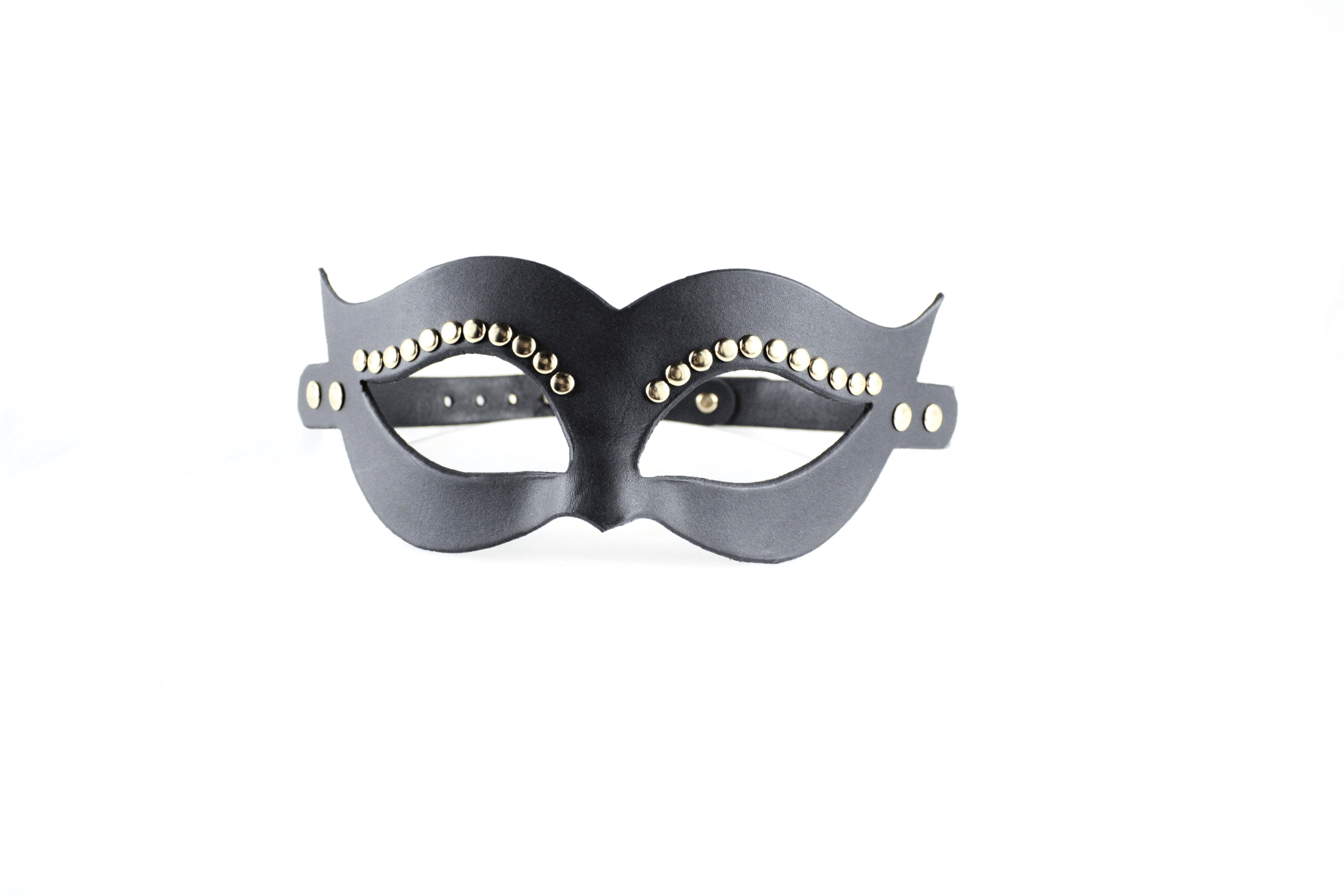 A black leather mask with decorative eye embellishments.