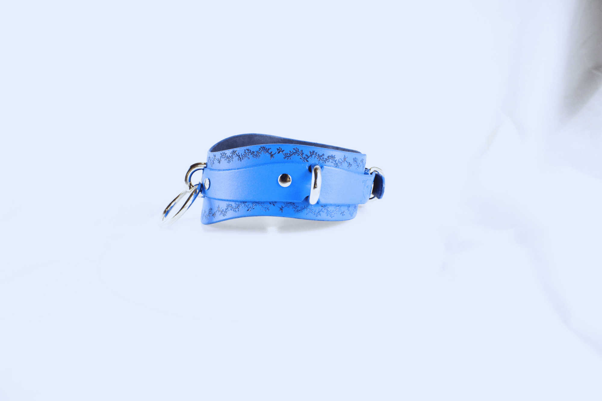 Floral Vine Posture Collar Discreet Leather Choker with O-Ring in blue leather featuring floral vine design.