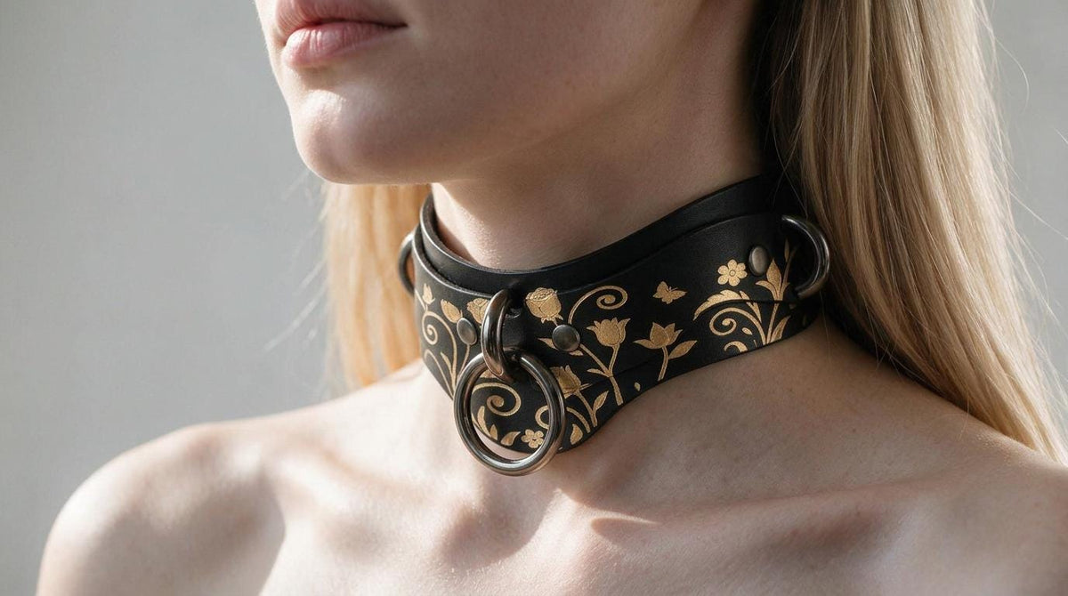 A close-up of a woman's neck and chest area wearing a black choker necklace with a floral design.