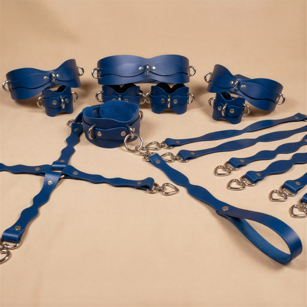A collection of blue leather straps and buckles arranged on a beige background.