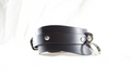 A black leather choker necklace with metal rings and buckles.