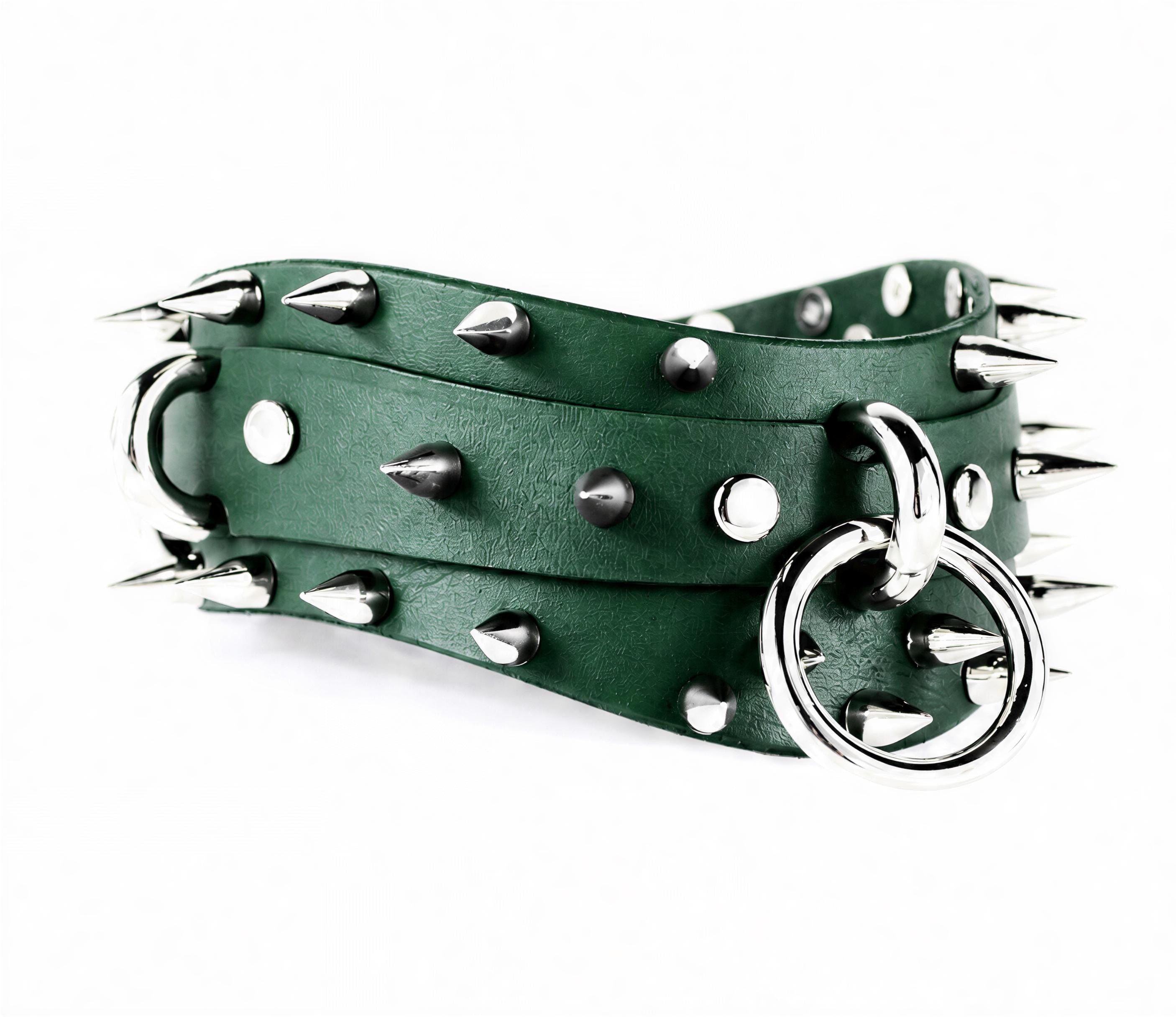 A green leather belt with silver spikes and a metal ring attached to it.