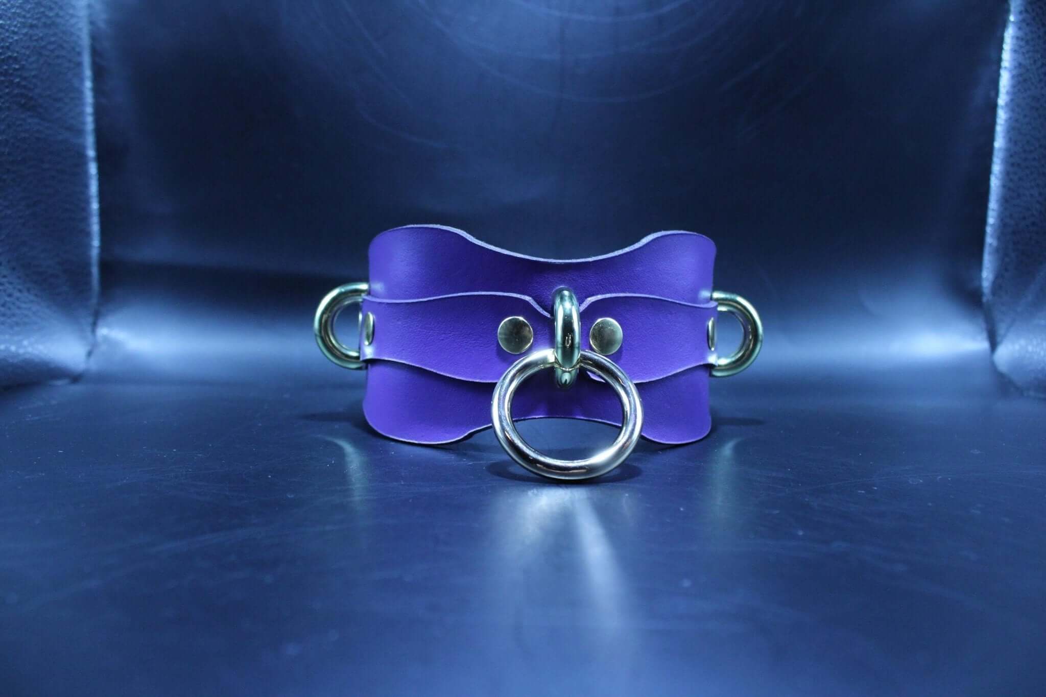 Purple BDSM posture collar with gold rings, perfect for submissive jewelry and bondage gear enthusiasts.