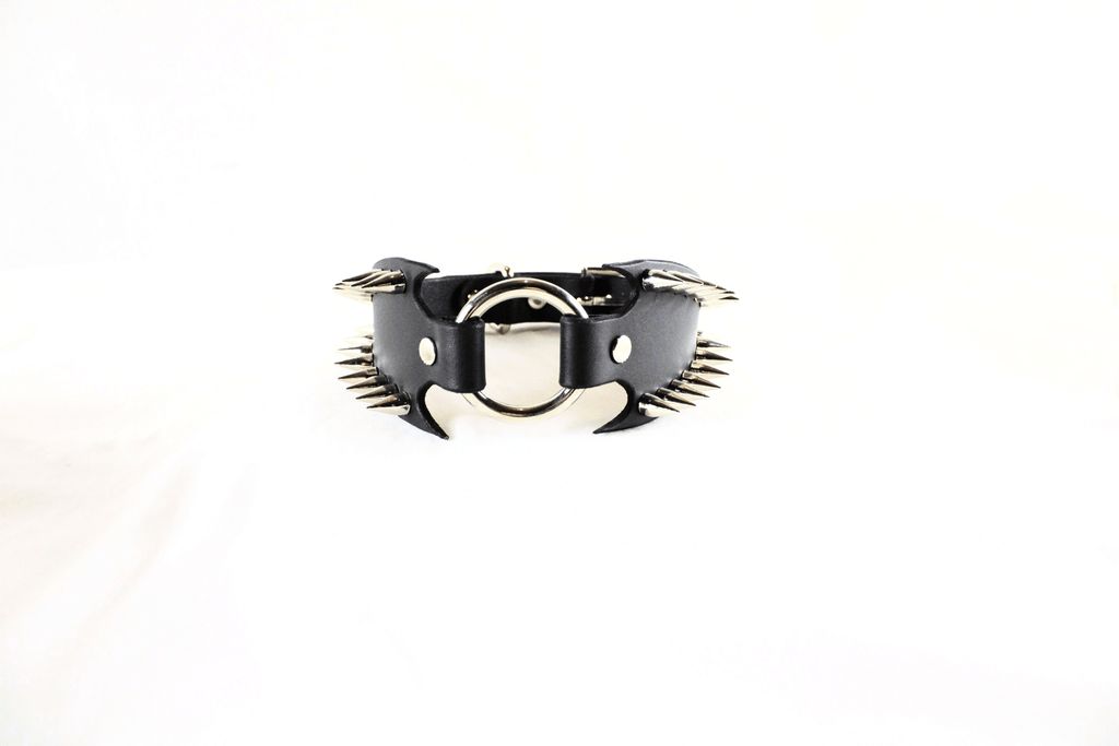Leather Submissive Collar with spikes and fanged edges, a bold BDSM accessory for fetish enthusiasts.