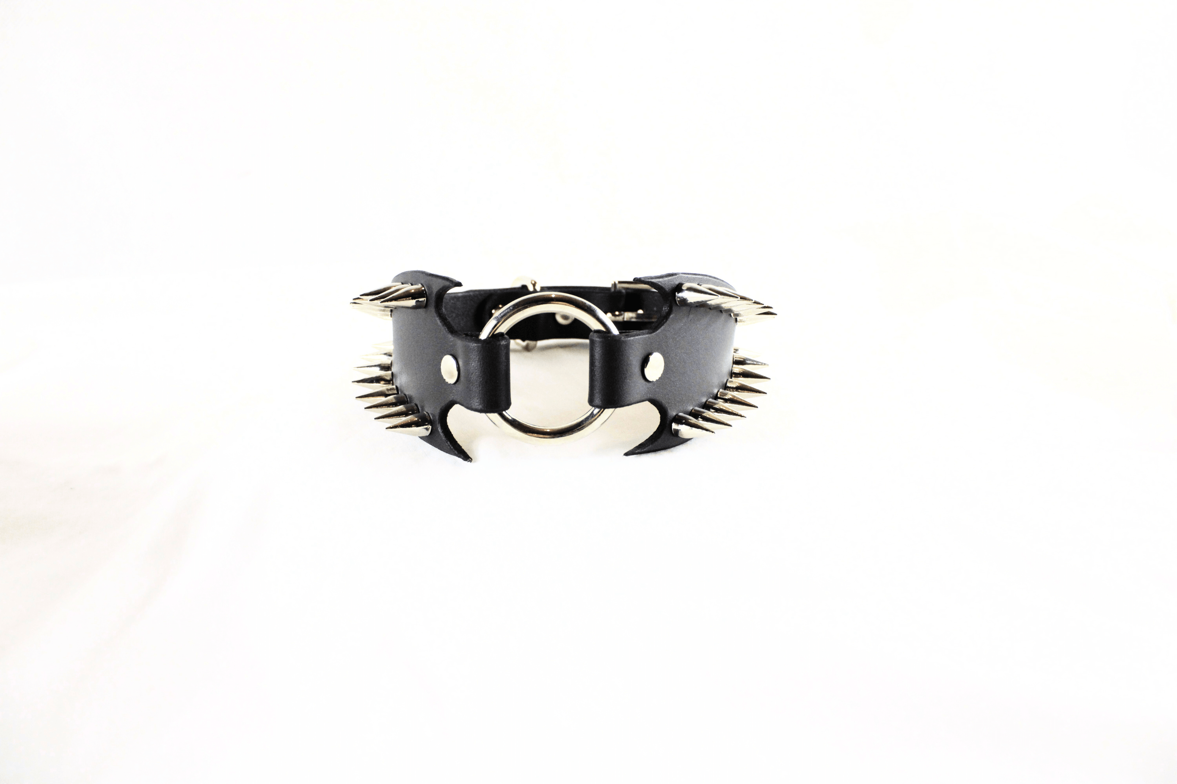 Leather Submissive Collar with spikes and fanged edges, a bold BDSM accessory for fetish enthusiasts.