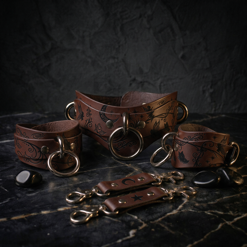 a collection of leather straps and buckles, including a corset-style belt and other accessories, arranged on a dark surface.