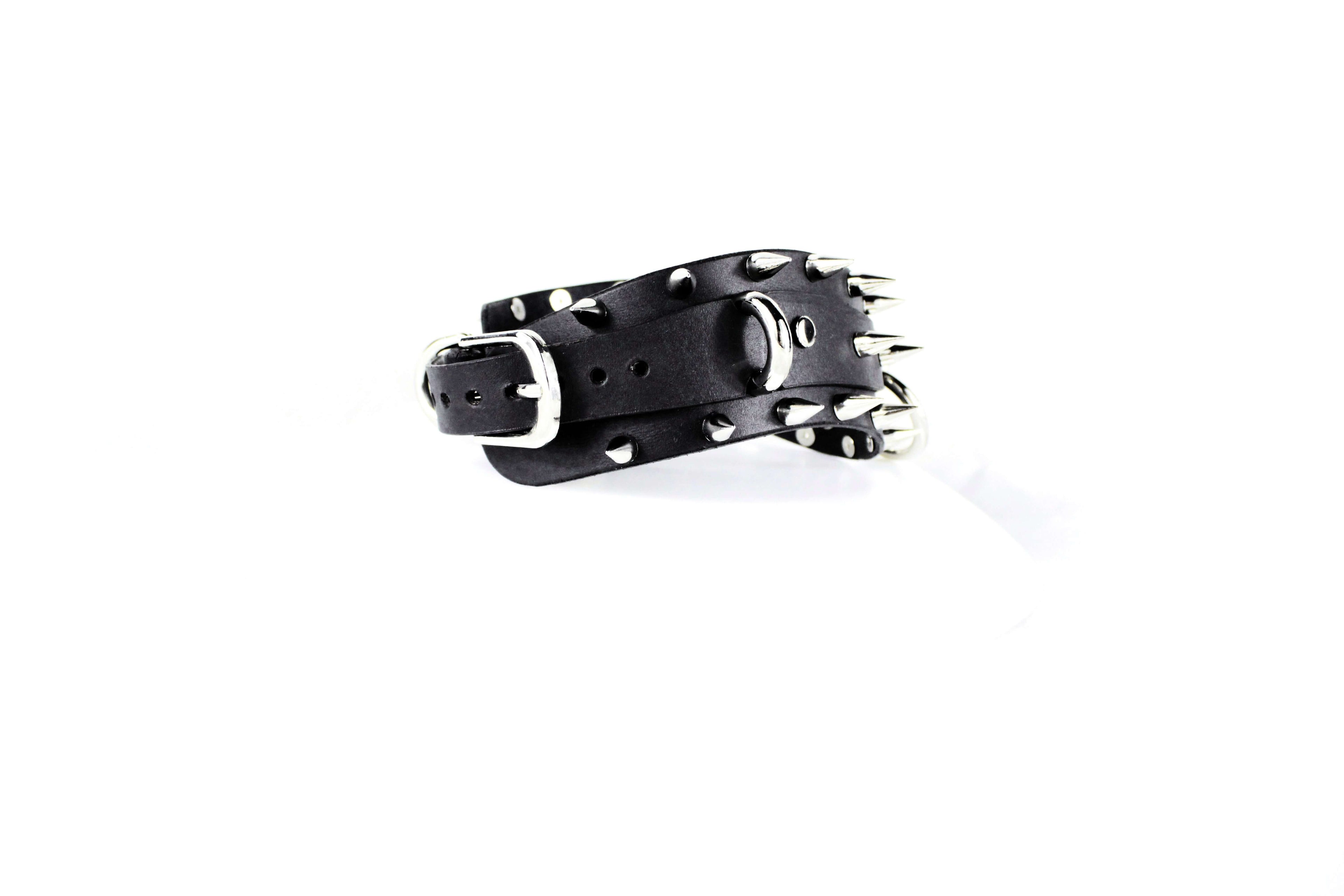 Spiked BDSM Collar handmade from black leather with silver spikes, embodying gothic elegance and raw power.