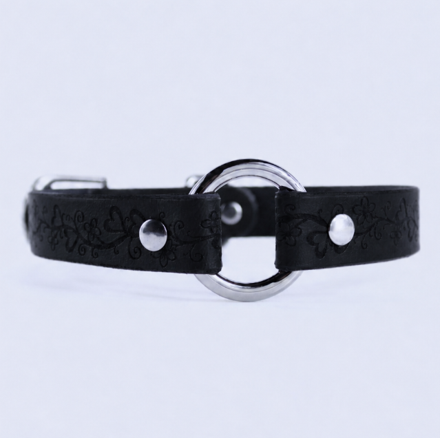 A black leather collar with a silver metal ring and two silver buttons.