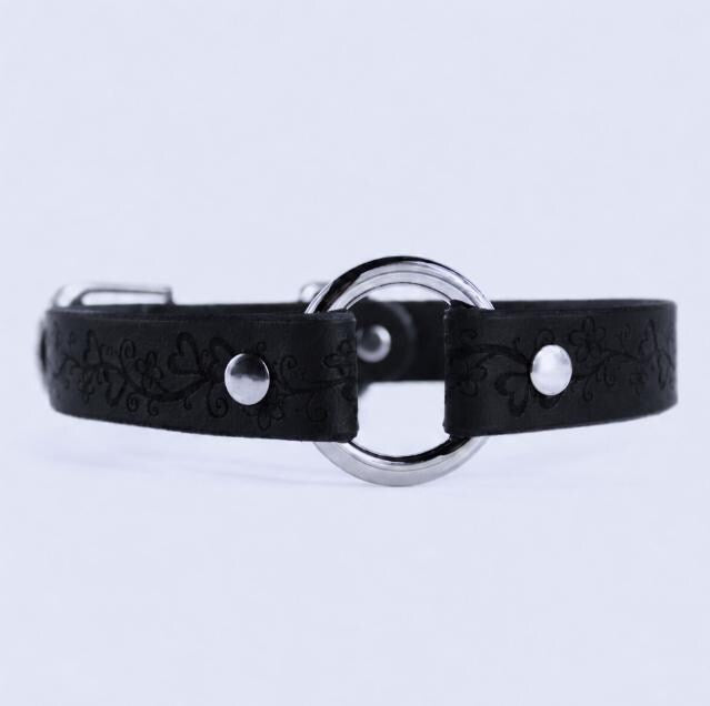 A black leather collar with a silver metal ring and two silver buttons.