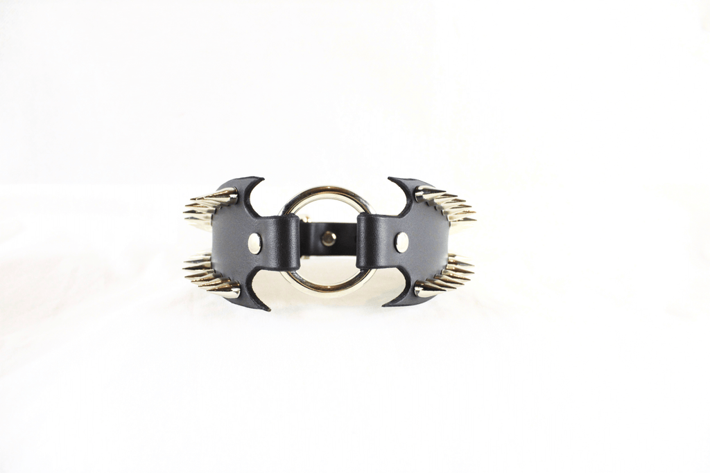 Leather Submissive Collar with sharp metallic spikes, highlighting gothic style and bold BDSM fashion.