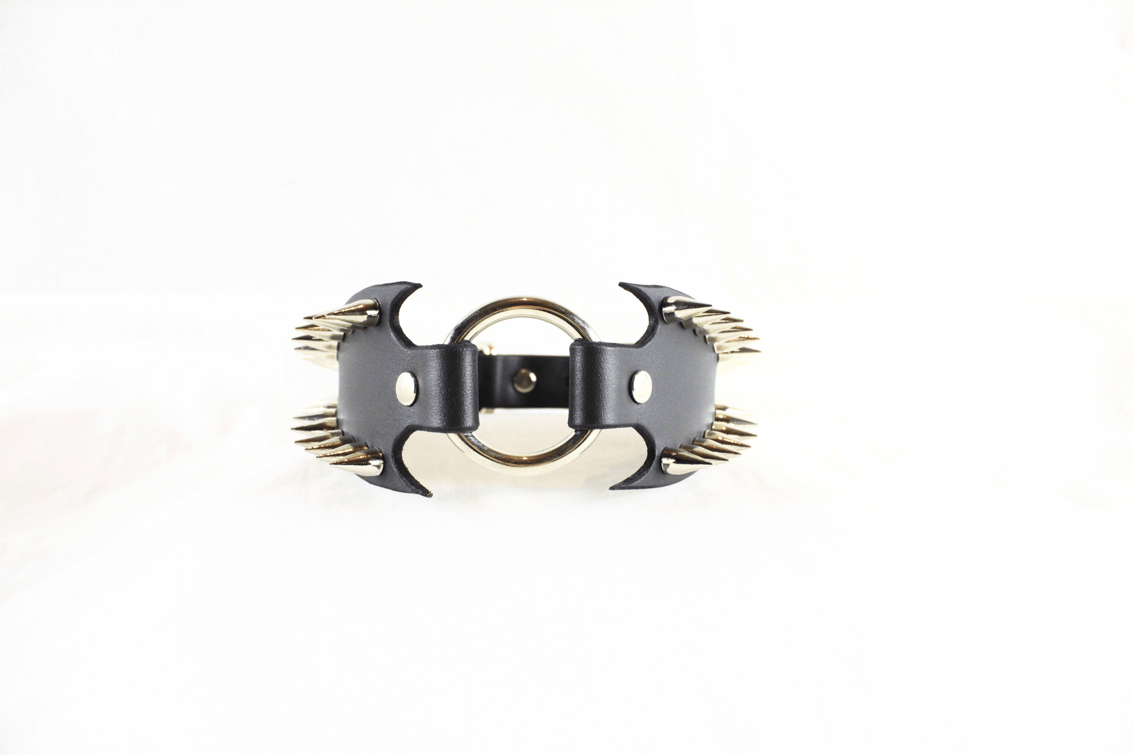 Leather Submissive Collar with sharp metallic spikes, highlighting gothic style and bold BDSM fashion.