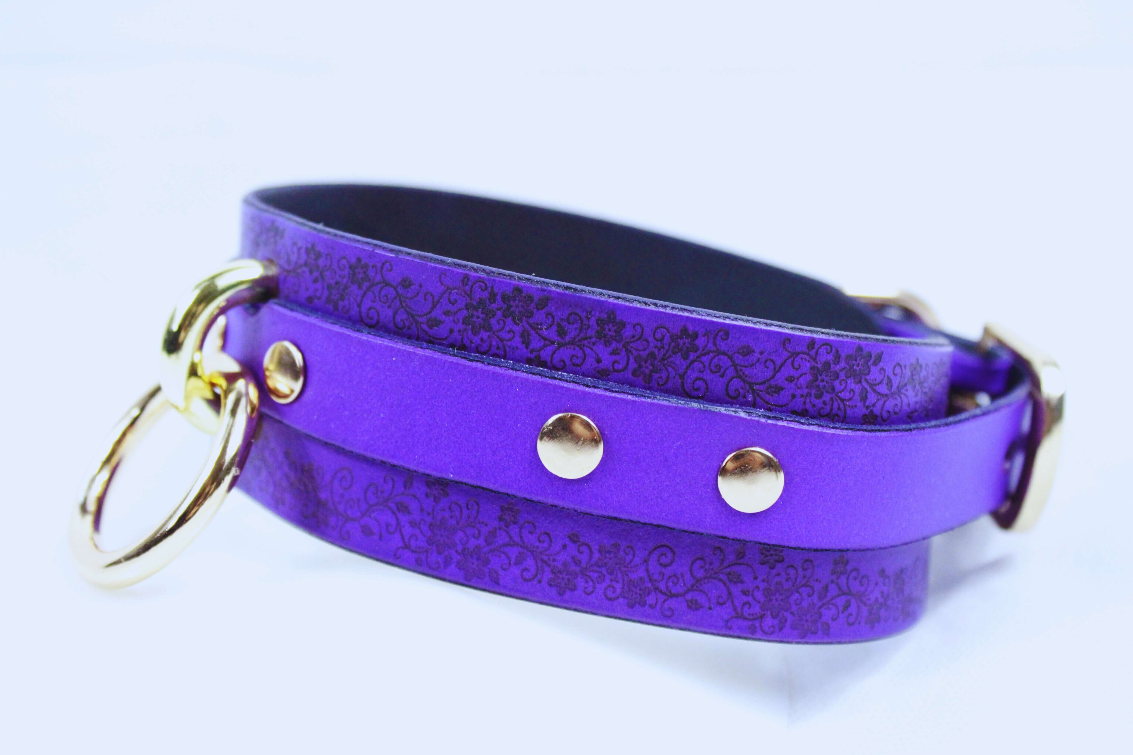 Floral Pattern Submissive Collar in purple leather with floral design and gold accents, ideal for discreet day wear.