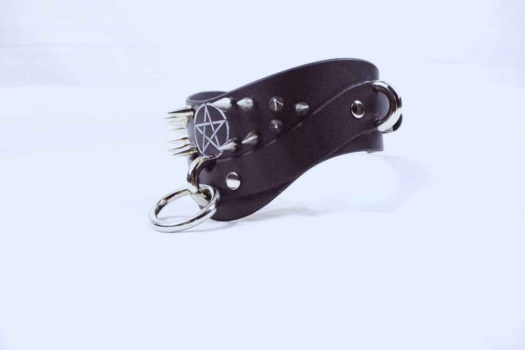 Pentagram BDSM Collar in black leather with silver spikes, a gothic-inspired submissive choker accessory.