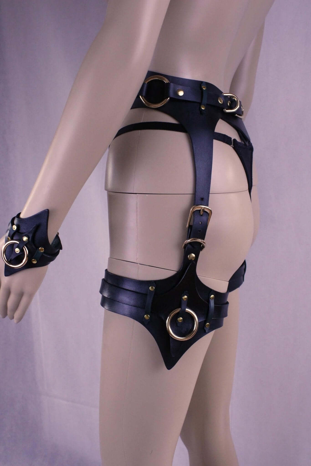 Leather thigh harness and cuffs set, perfect for BDSM play and bondage gear enthusiasts.