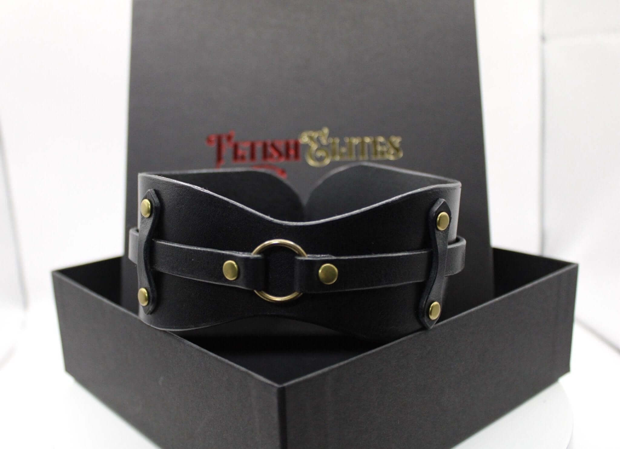 Black leather choker collar with O-ring, perfect for BDSM, submissive jewelry, and edgy fashion statements.