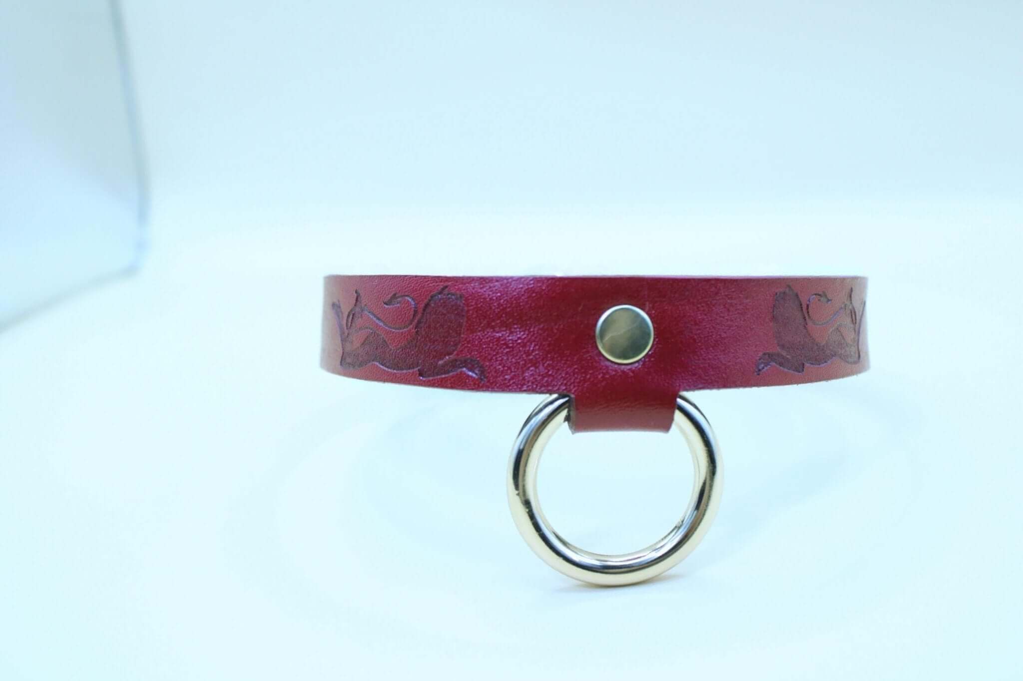 BDSM collar with devil girl design, red leather choker for submissive jewelry and bondage gear.
