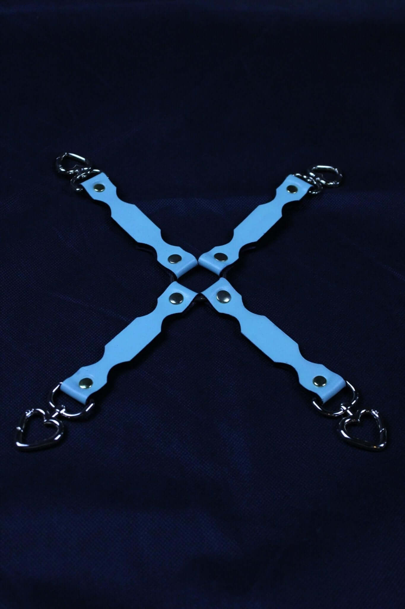 BDSM connector straps in blue with heart-shaped metal clasps, perfect for bondage gear and restraint accessories.