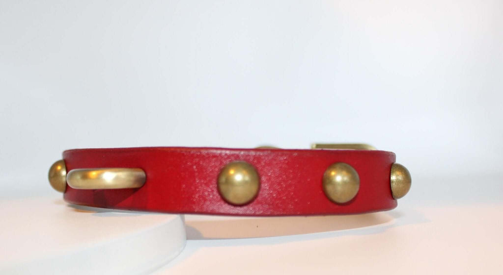 Bold red leather BDSM collar with antique brass studs, ideal for submissive jewelry and alternative fashion enthusiasts.