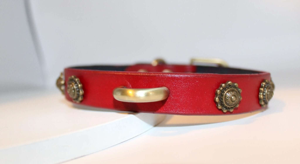 Vintage leather submissive collar with antique-style studs and gold D-ring for BDSM and alternative fashion.