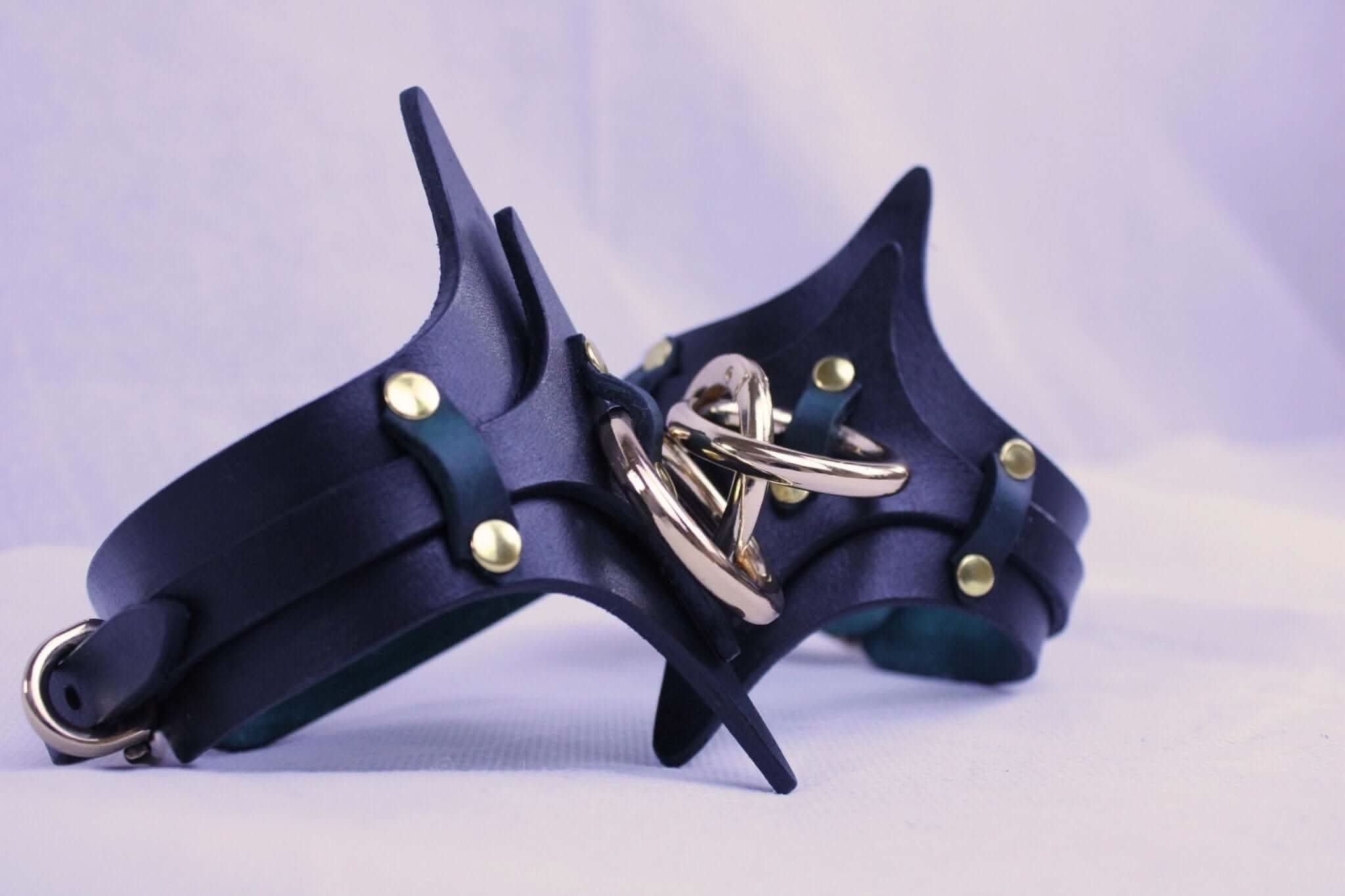 Handmade BDSM leather handcuffs with brass hardware, perfect for bondage play and submissive partners.