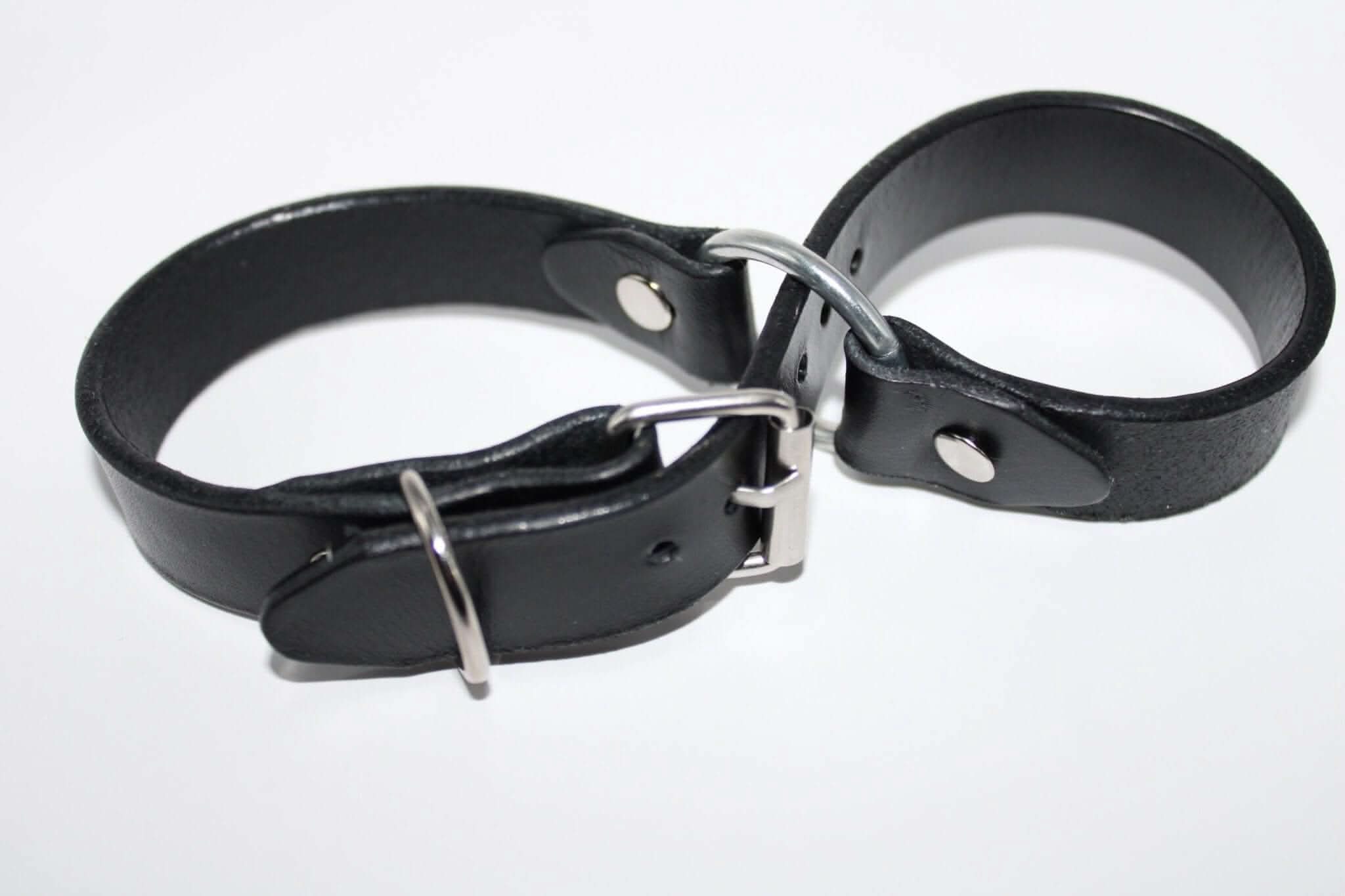 Real leather handcuffs for BDSM play, designed for comfort and intimacy in bondage and power exchange scenarios.