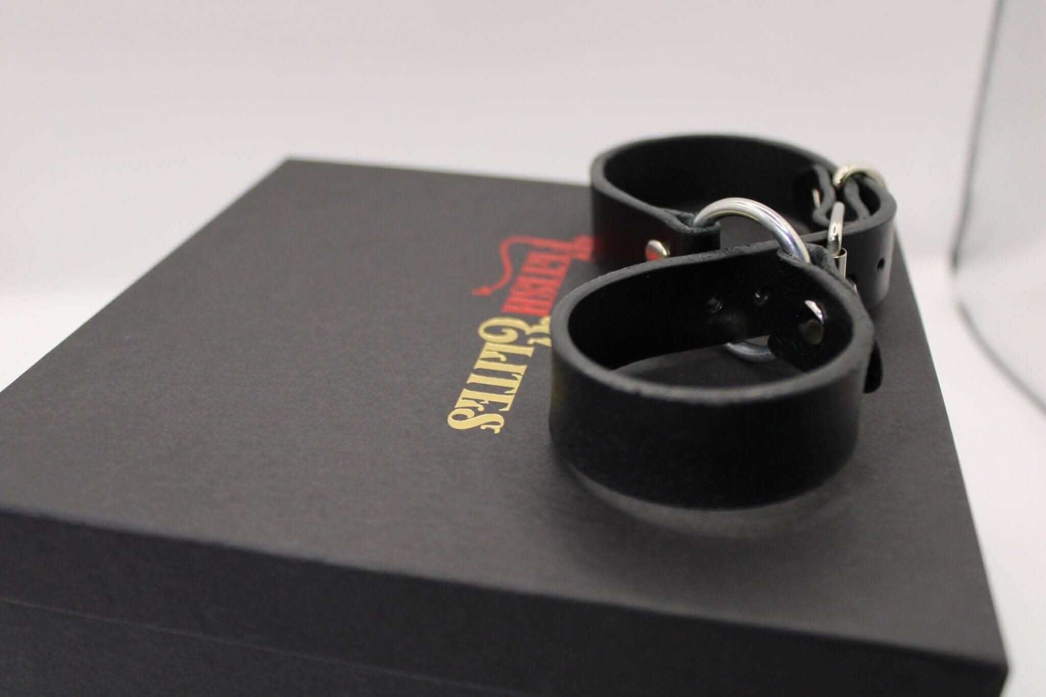 Real leather handcuffs in a stylish box, perfect for BDSM, bondage gear, and intimate power play.