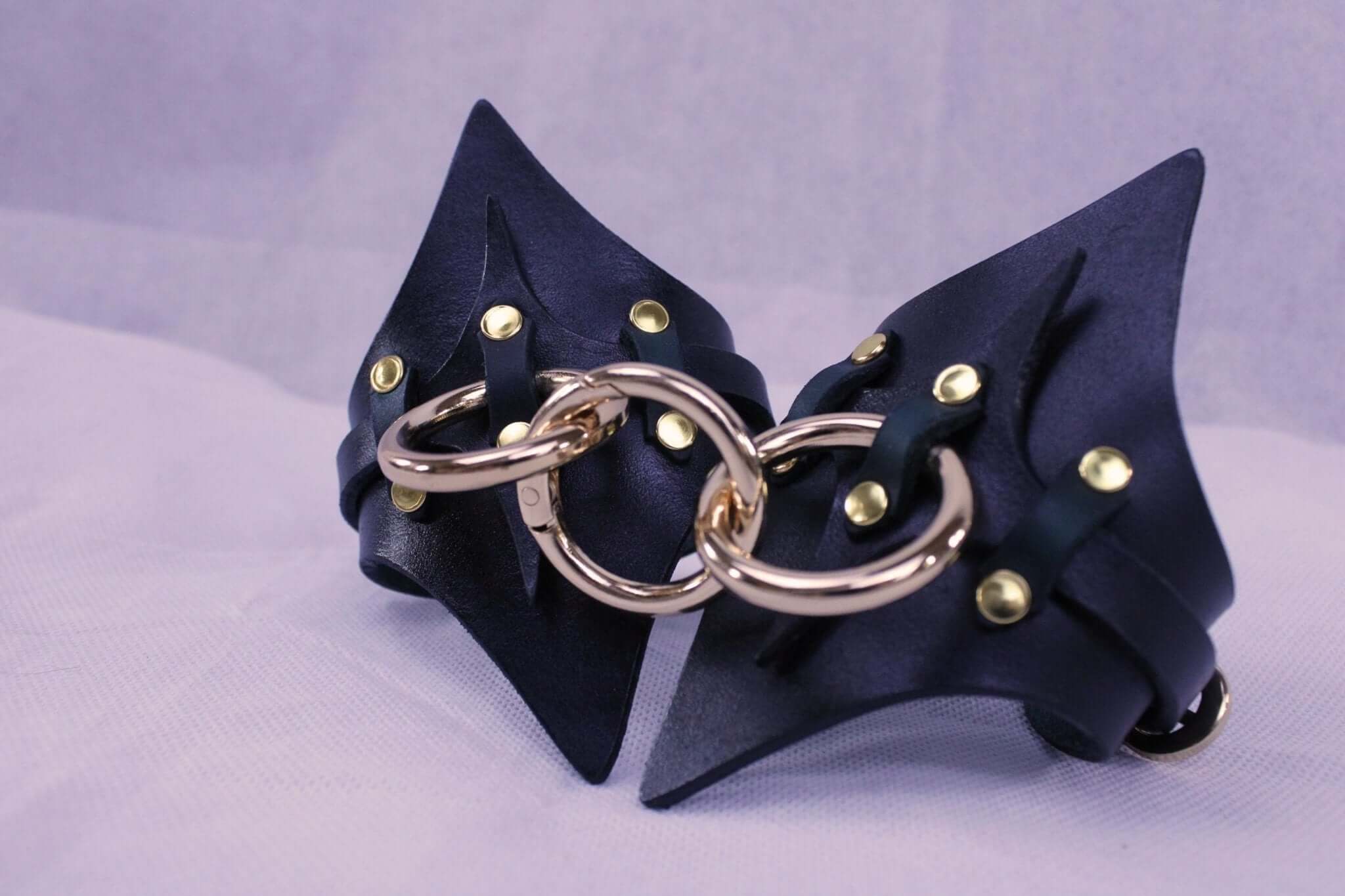 Premium leather handcuffs with metal rings and studs, perfect for BDSM gear and bondage play.