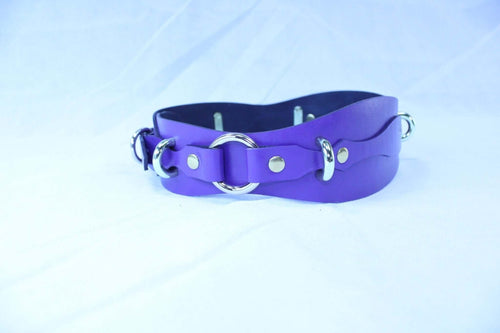 Purple leather restraint belt with D-rings, ideal for BDSM play and bondage gear, handcrafted for dominance and submission.