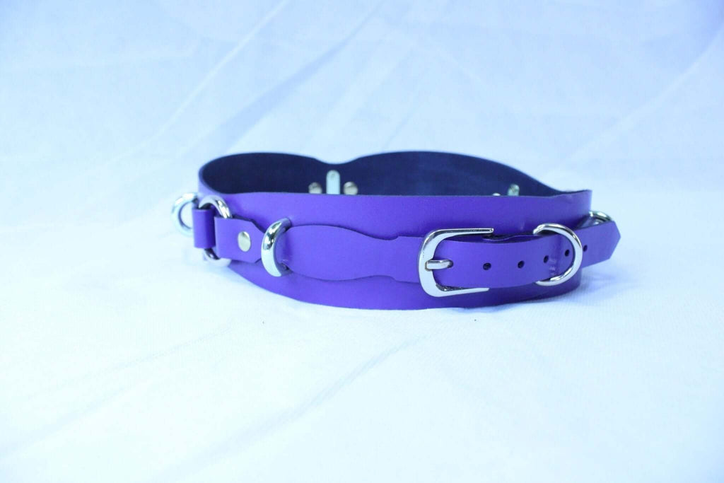 Purple leather restraint belt with D-rings for BDSM and bondage play, perfect for both dominance and submission.