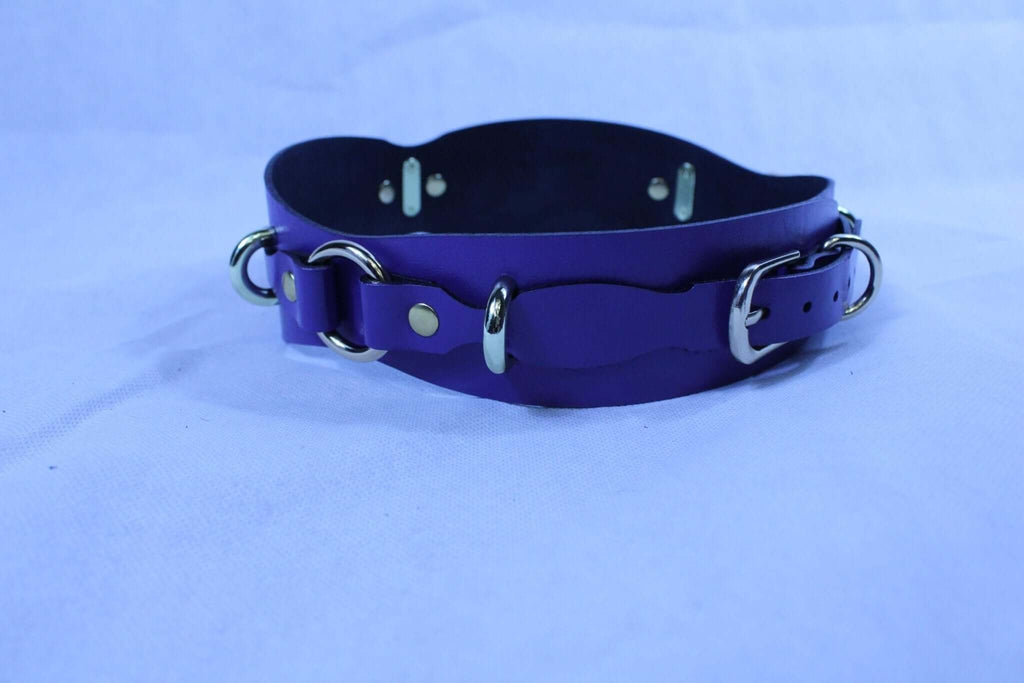 Purple leather restraint belt with D-rings, ideal for BDSM play and bondage gear.