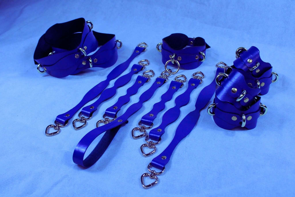 Handmade blue leather BDSM restraint kit featuring collars and cuffs for sub and dom play, enhancing bondage experience.