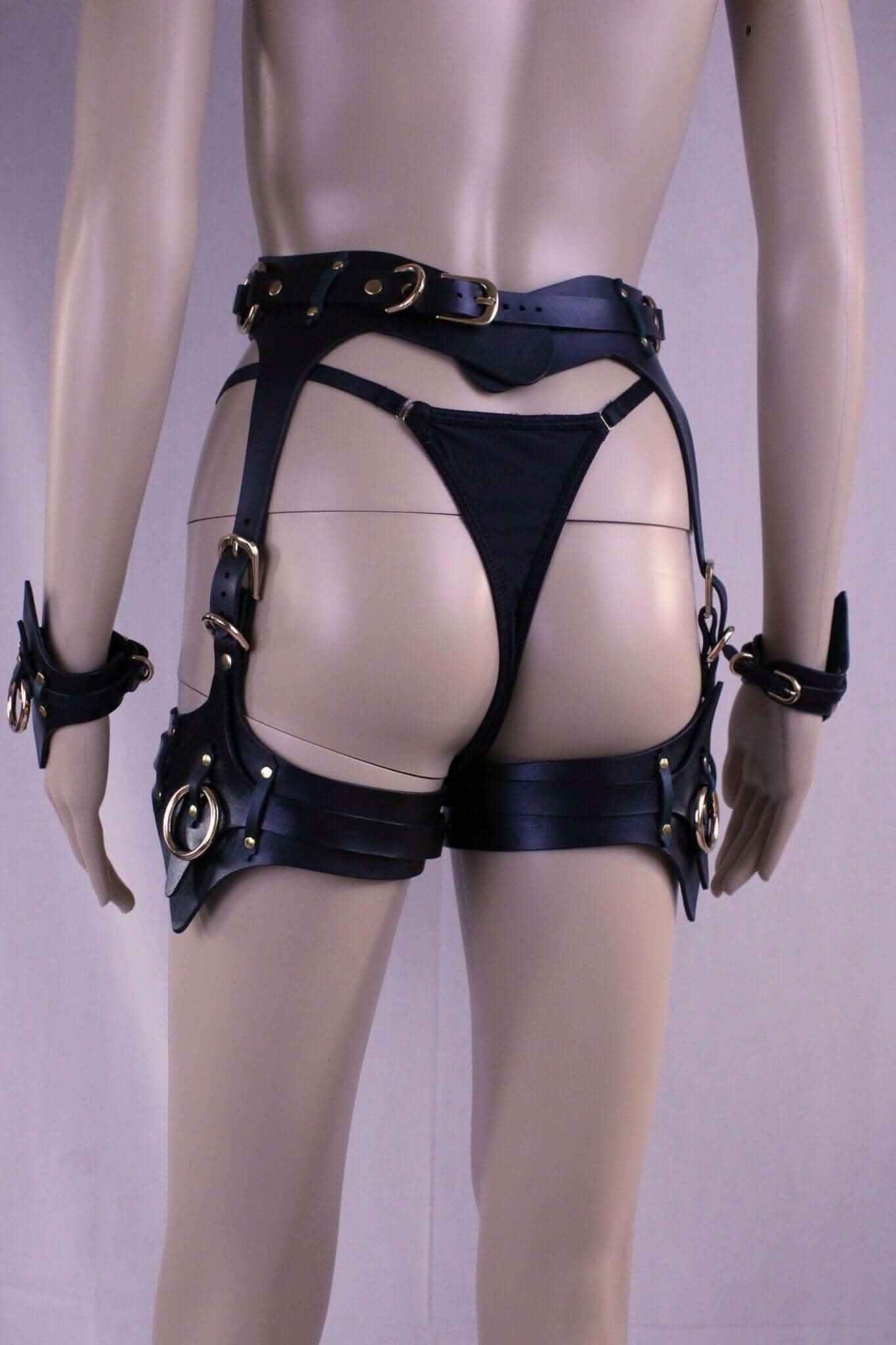 Leather thigh harness and cuffs set showcasing premium BDSM gear for bondage and erotic lingerie.
