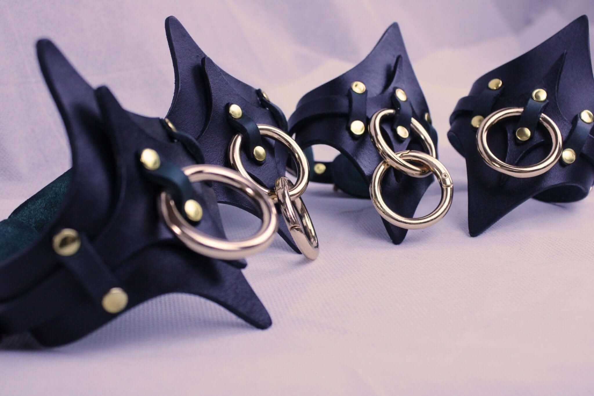 Leather thigh harness and cuffs set with metal rings, ideal for BDSM and bondage lingerie enthusiasts.