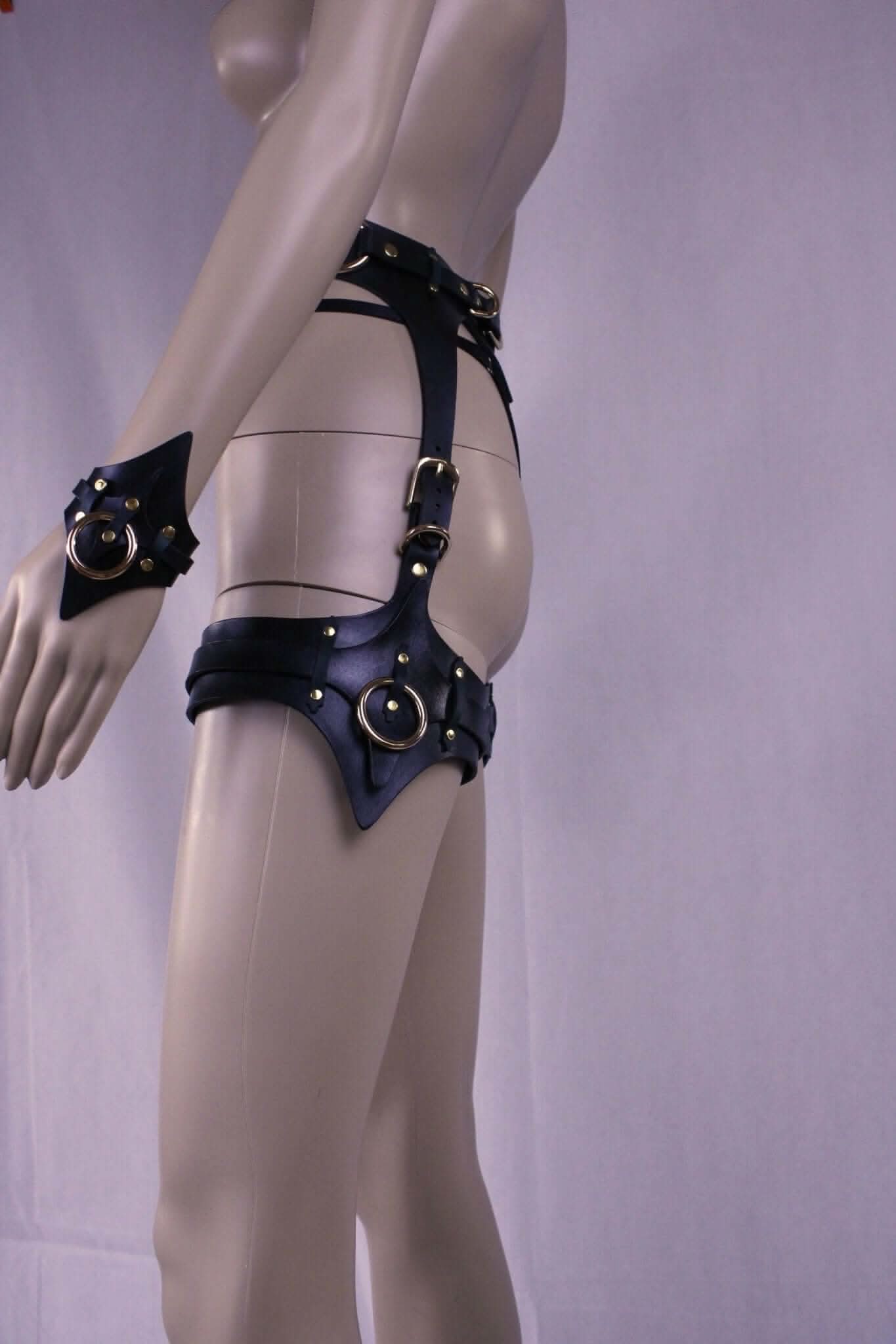 Leather thigh harness and cuffs set, showcasing BDSM bondage gear with premium Italian leather, perfect for erotic lingerie.