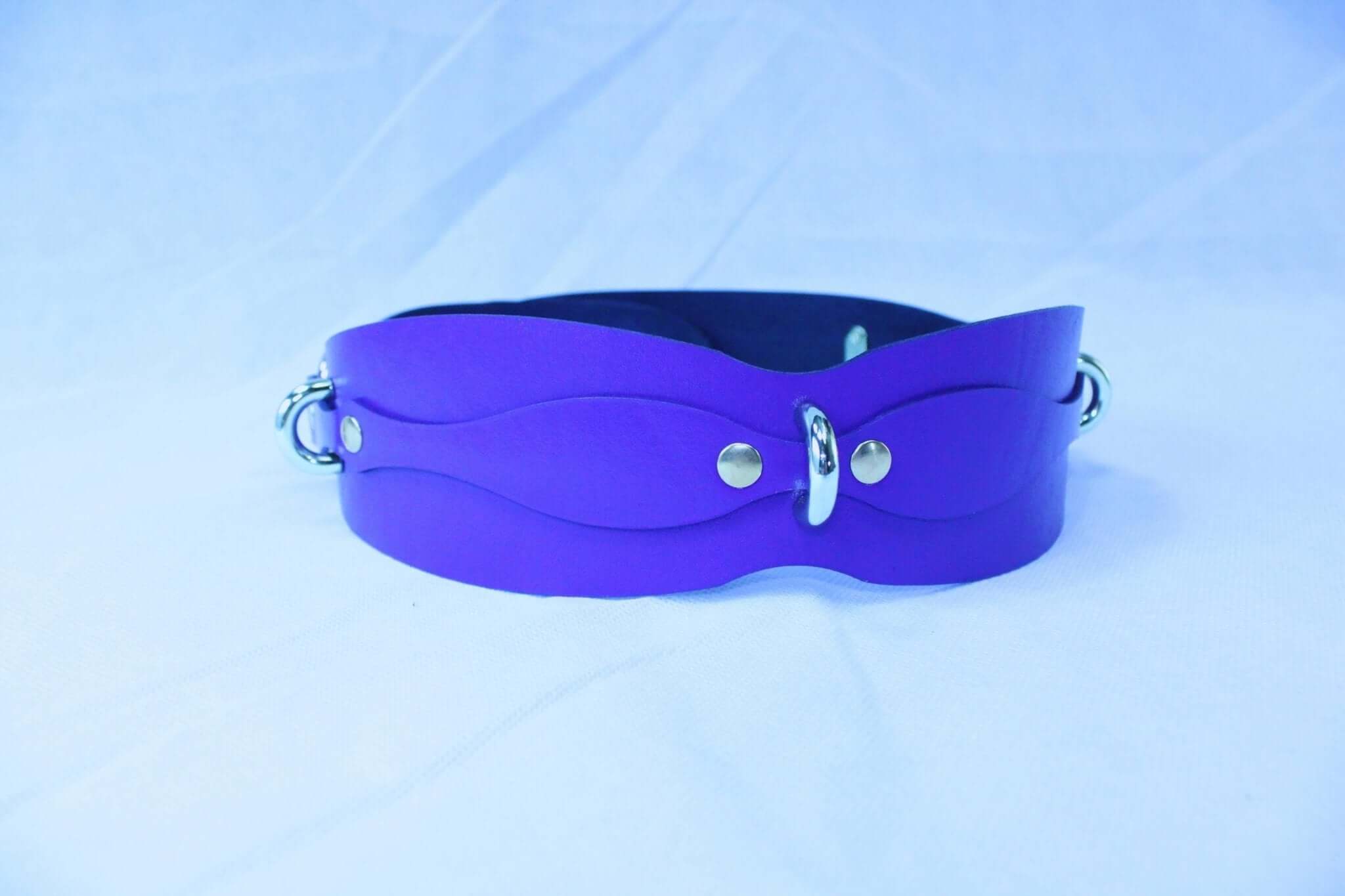 Purple leather waist belt harness for BDSM, adjustable restraint gear for posture control and submission.