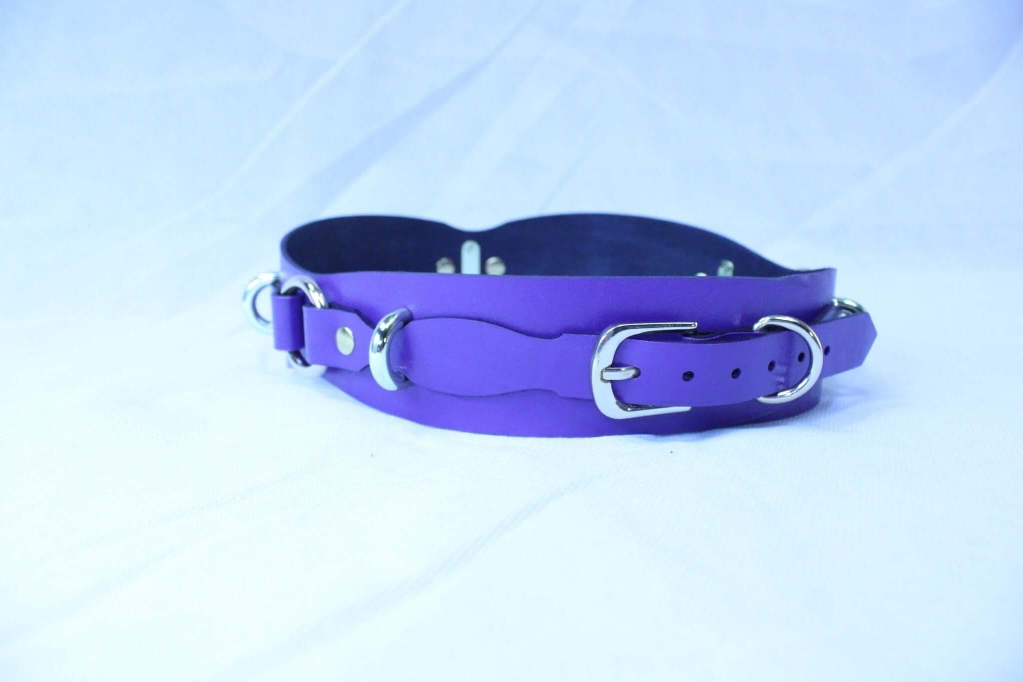 Purple leather waist belt with D-rings, perfect for BDSM gear and adjustable restraint harness.