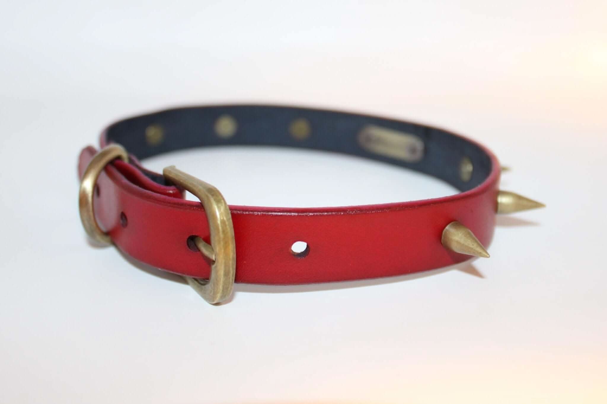Red spiked BDSM collar with metallic accents, ideal for punk fashion, submissive jewelry, and bondage gear.