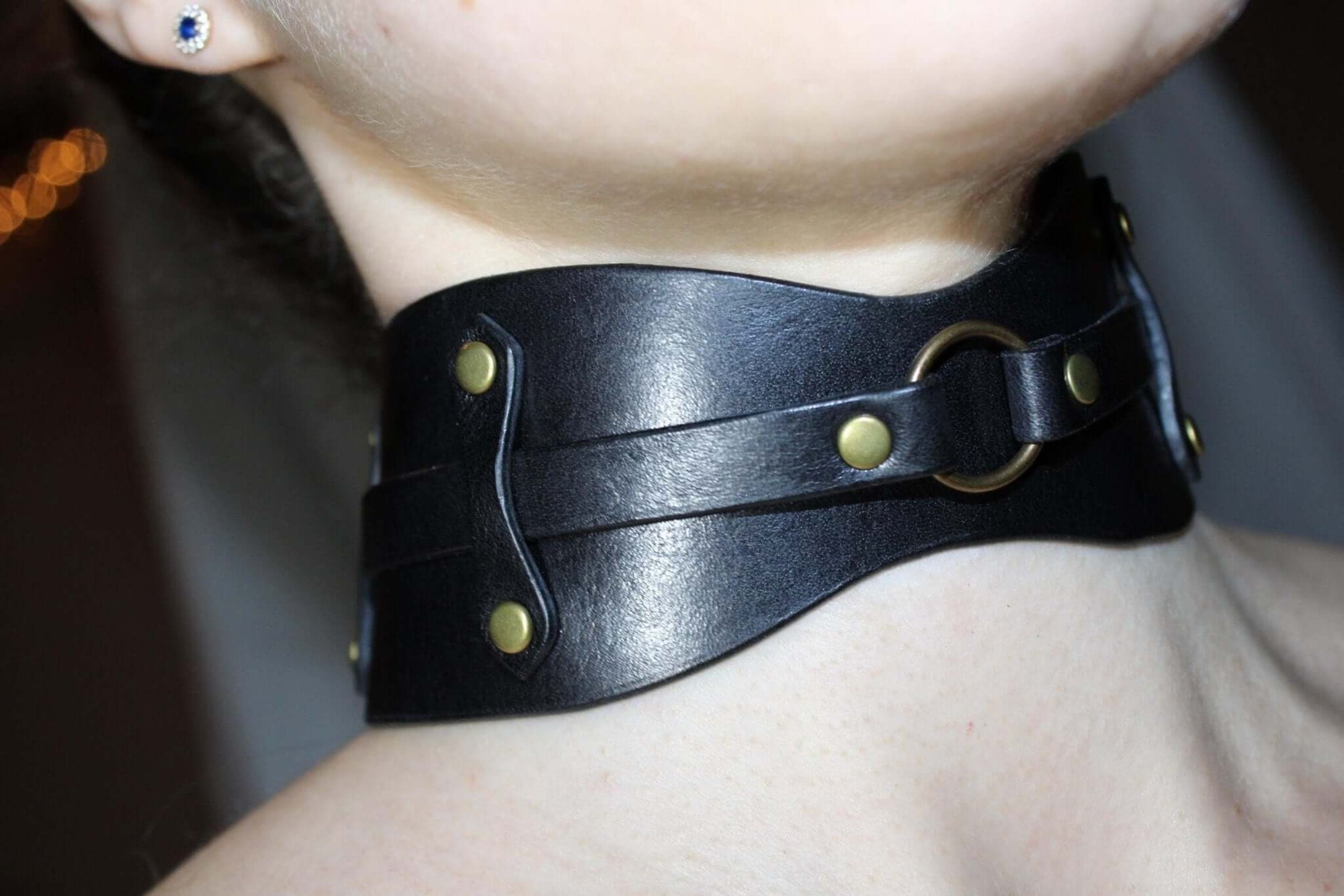 Edgy black leather choker collar with O-ring, perfect for bondage and BDSM fashion enthusiasts.