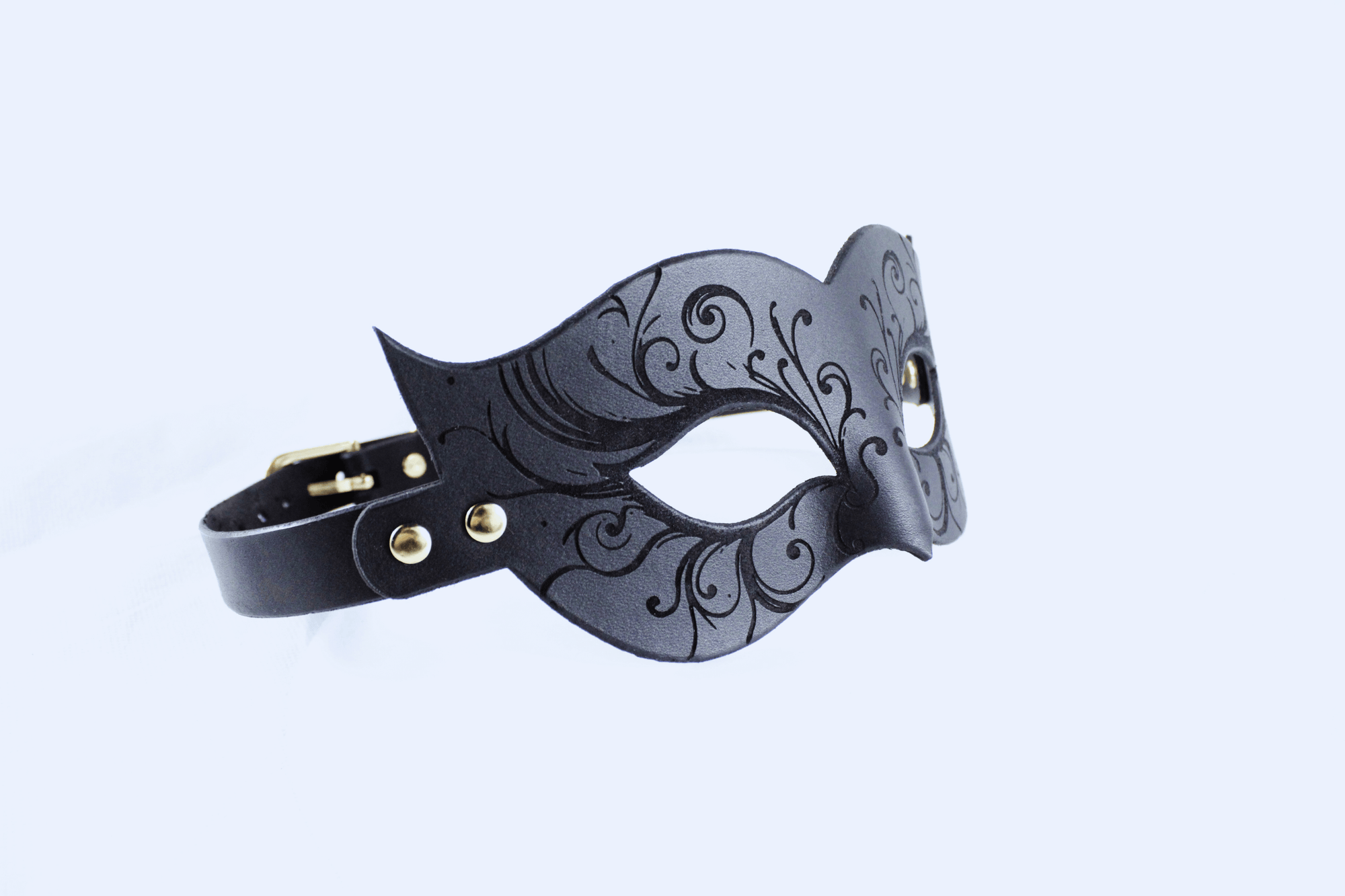Leather Bondage Mask with intricate black floral details and elegant Venetian design.