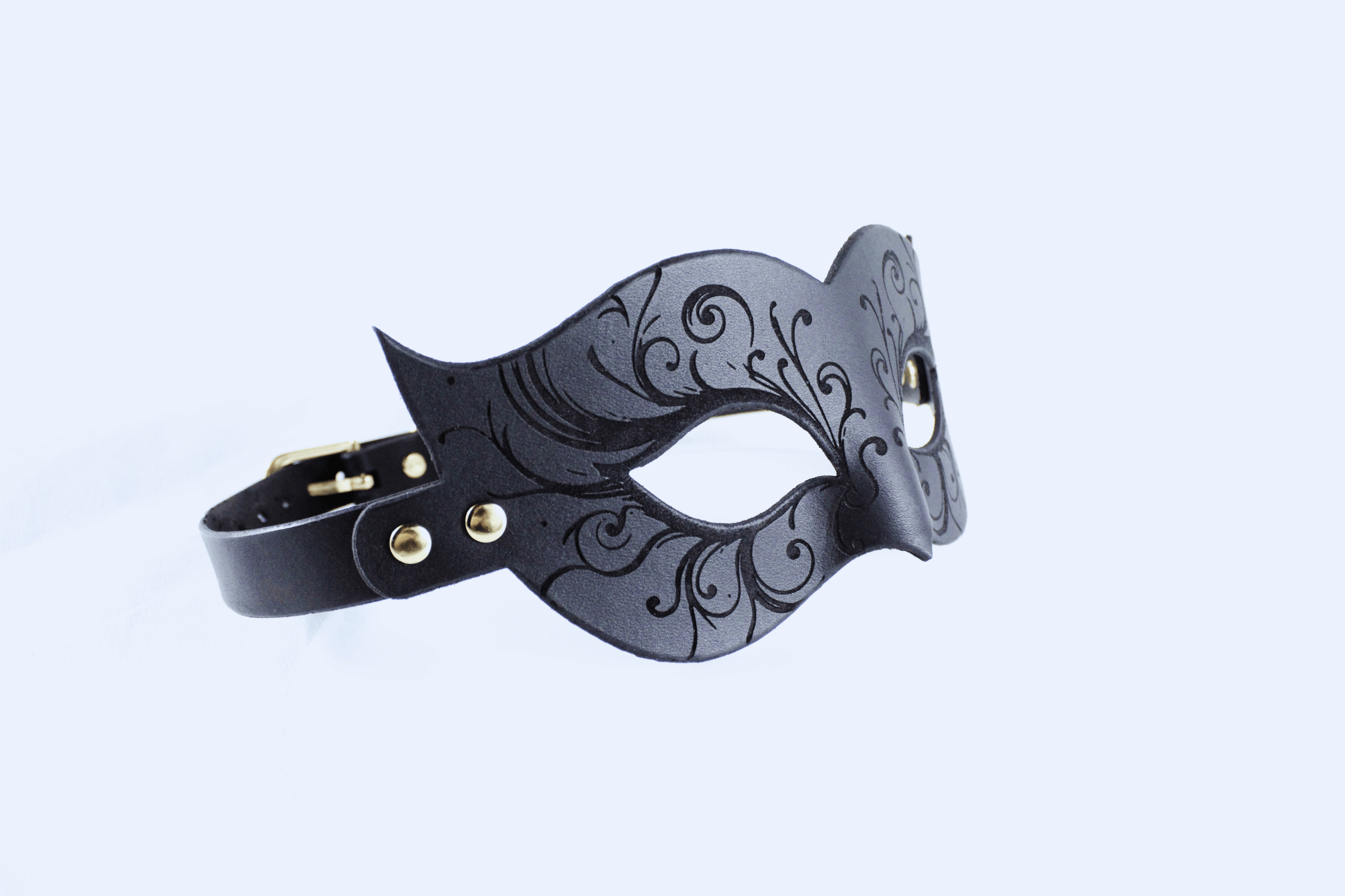 Leather Bondage Mask with intricate black floral details and elegant Venetian design.