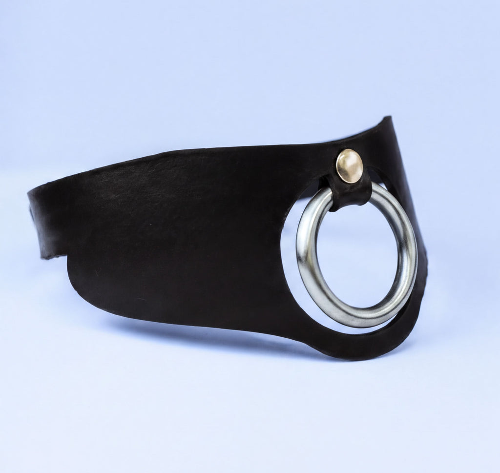 A black leather choker necklace with a silver ring on the front.