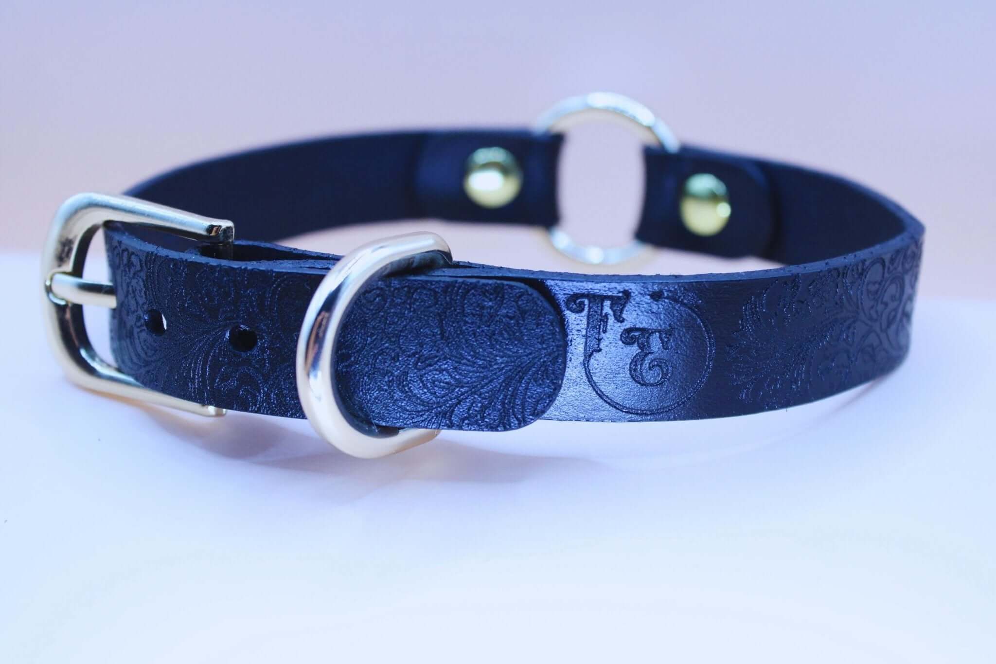 Elegant black BDSM sub collar with embossed floral texture, perfect for discreet day wear and submissive jewelry.