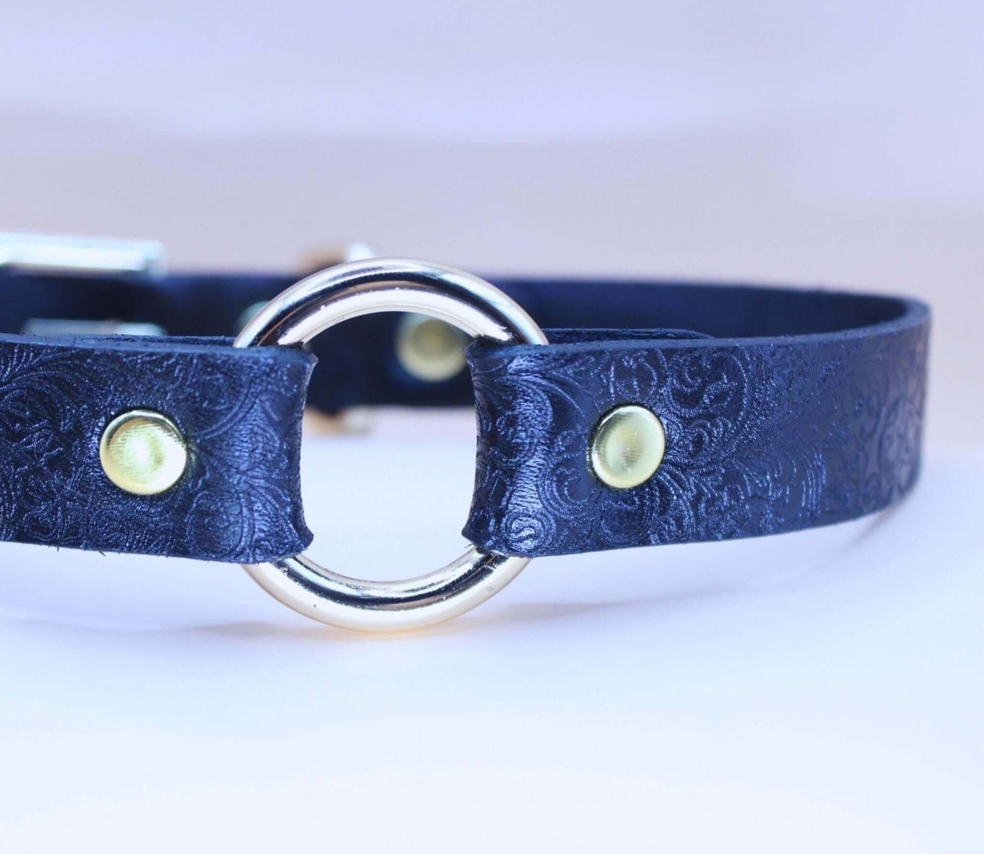 Elegant black BDSM sub collar with embossed floral texture, perfect for discreet daily wear and submissive jewelry.