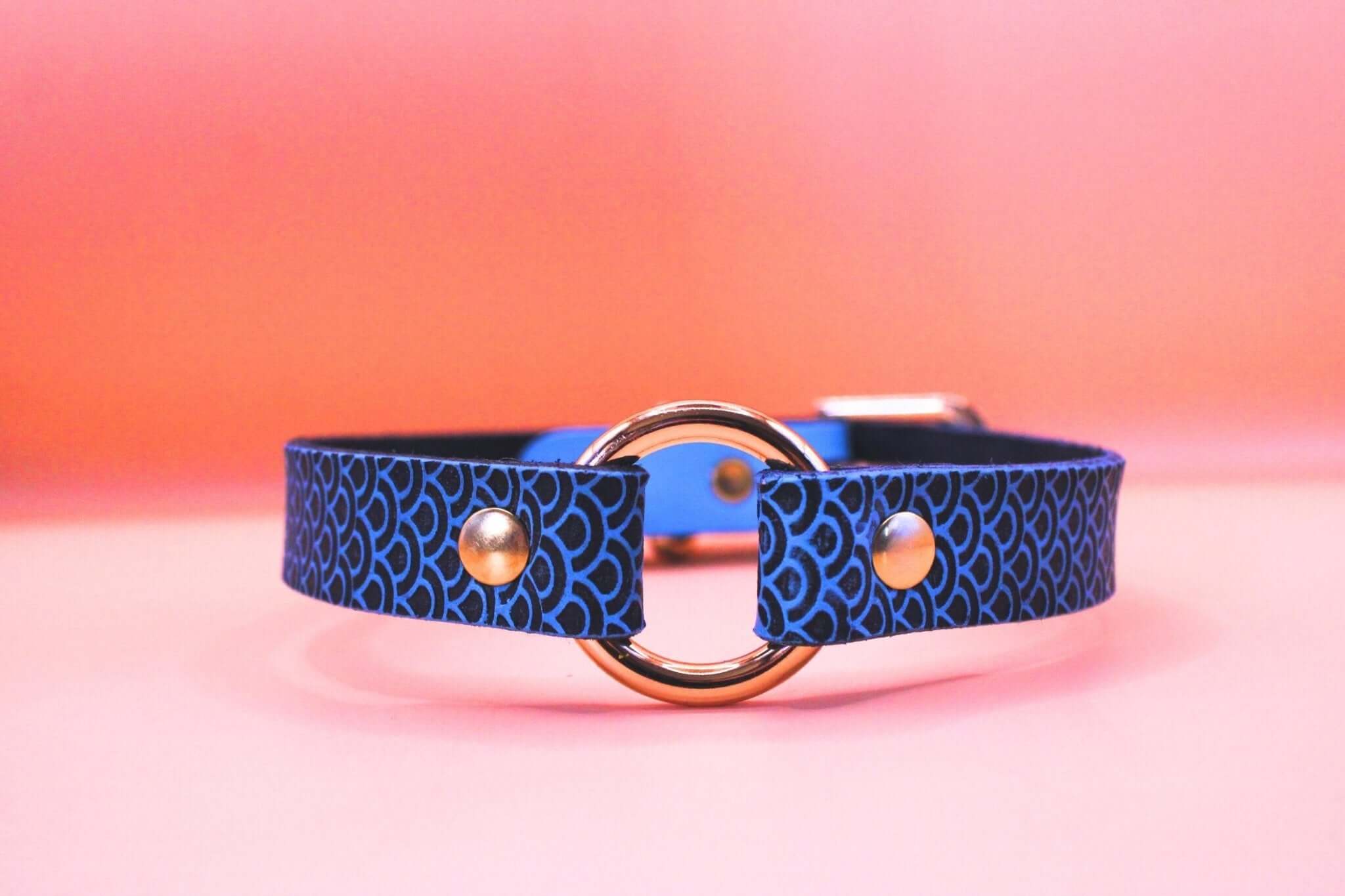 Blue leather choker collar with ring detail, perfect for discreet sub wear and BDSM jewelry, ideal for submissive expression.