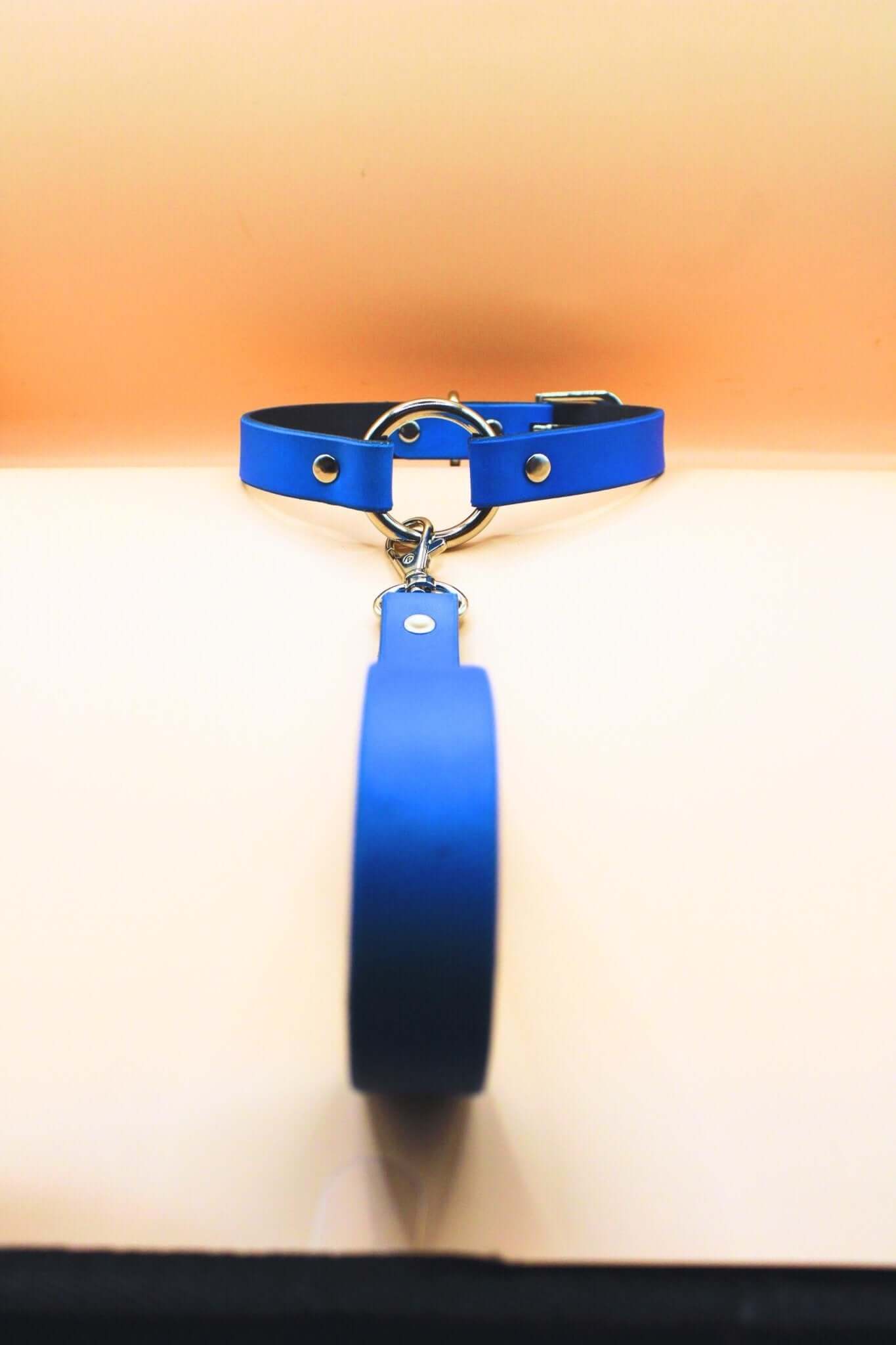 Blue leather choker with leash, a stylish BDSM collar for discreet submissive jewelry and bondage gear.