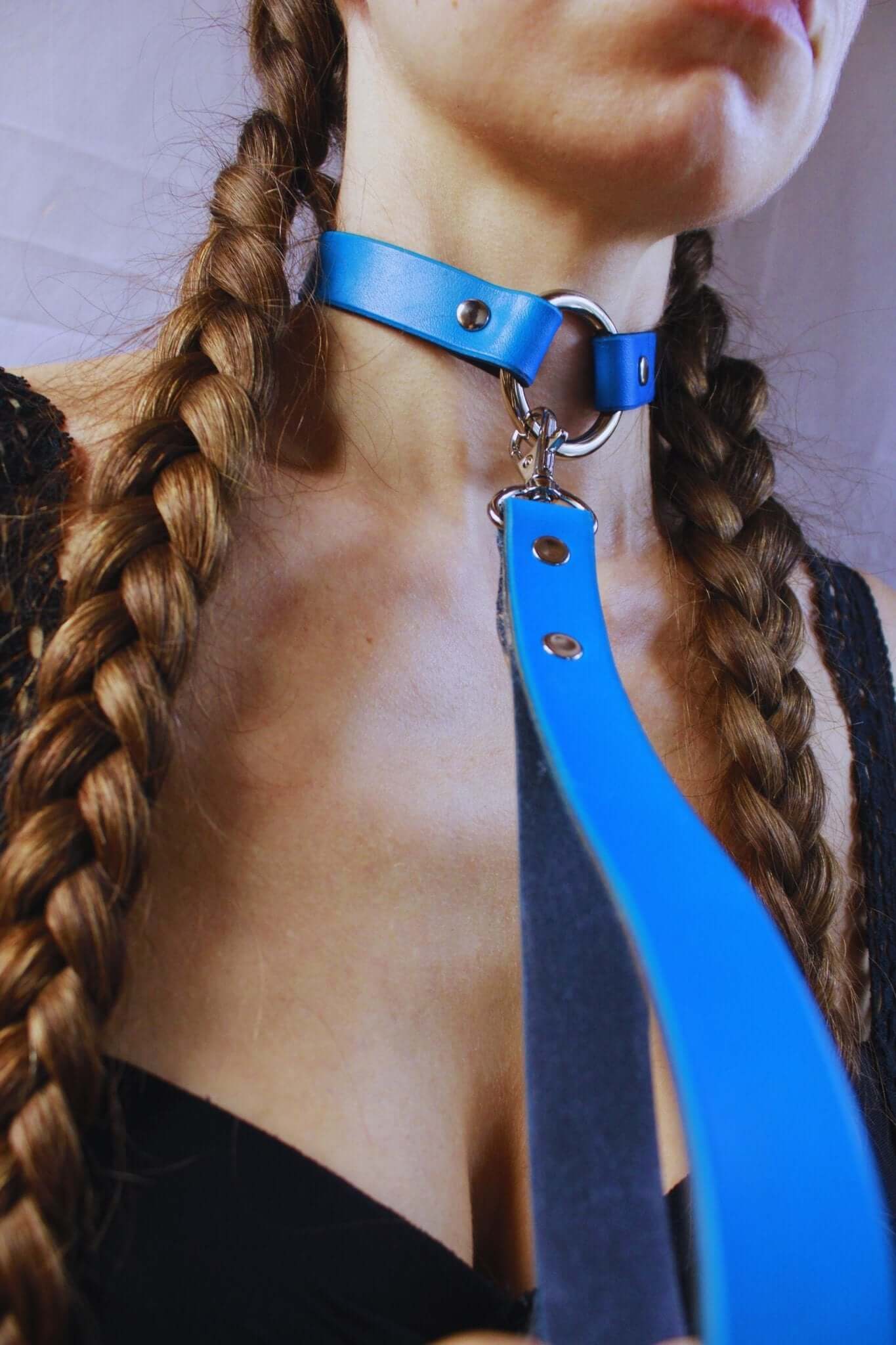 Blue leather choker with leash, a discreet submissive collar for BDSM jewelry and bondage gear.